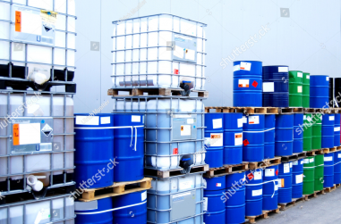 stock-photo-white-container-and-blue-drums-on-an-industrial-storage-site-29910334